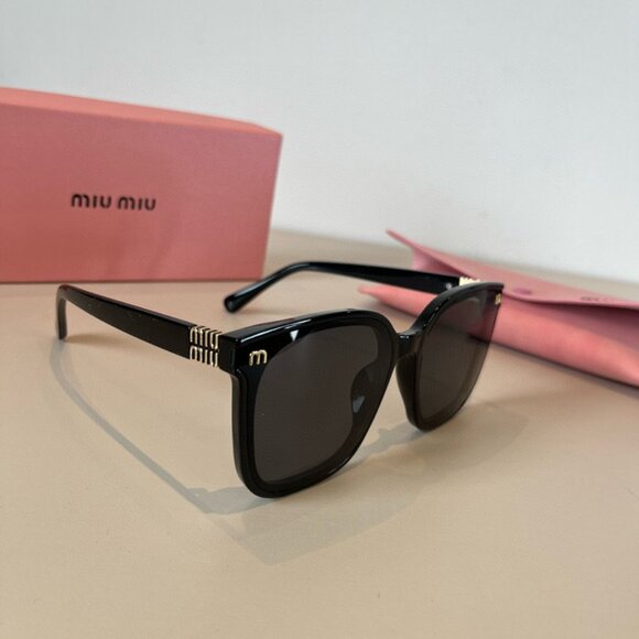 Miu Miu Black Sunglasses with Gold Detail - Picture 1 of 7